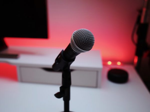 A pink microphone in a studio