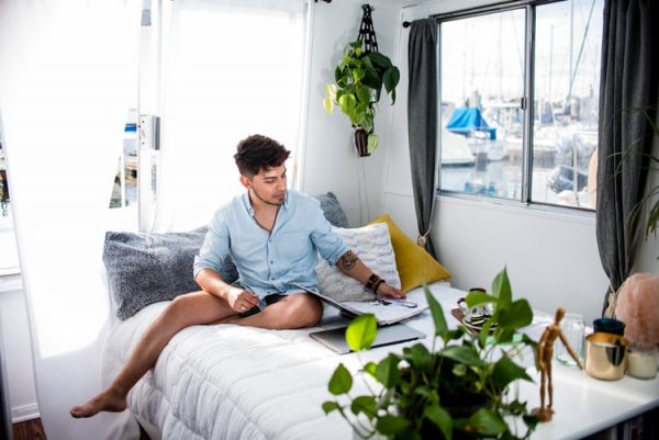 guy on the bed with laptop