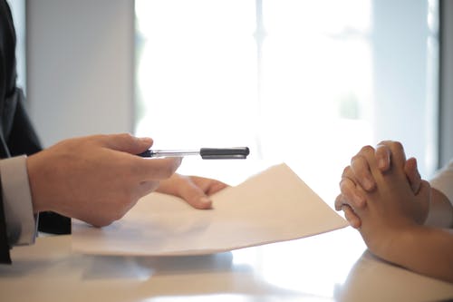 lawyer signs documents of company registration 