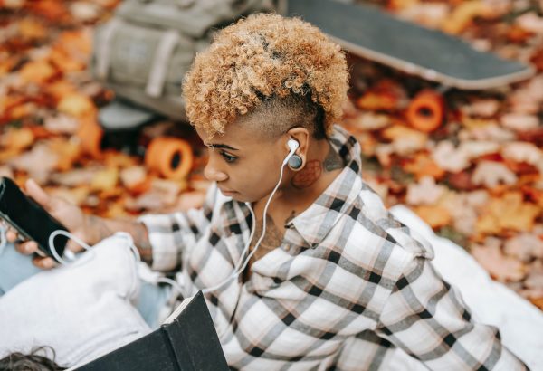 Lady listening to new podcasts in Nigeria