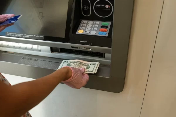 student withdraws money from an ATM 